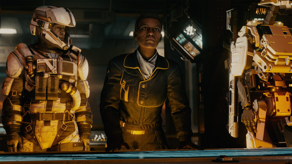 A pilot in a flight suit and a crew member in a navy uniform stand over a glowing blue tactical holomap.