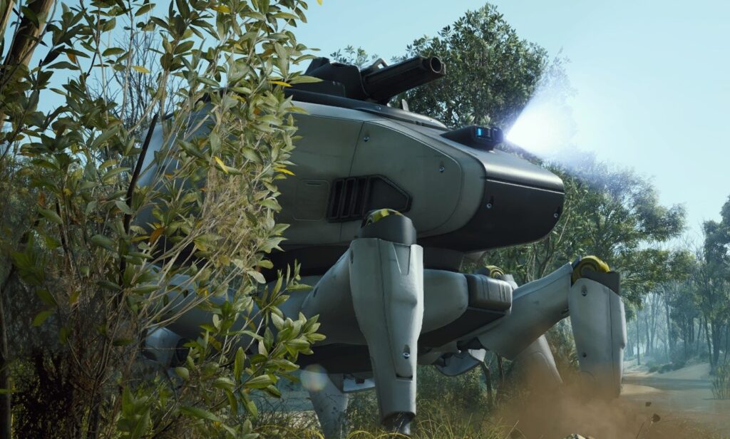 A heavy white and grey Bombardier machine with a top-mounted cannon hidden behind green foliage.