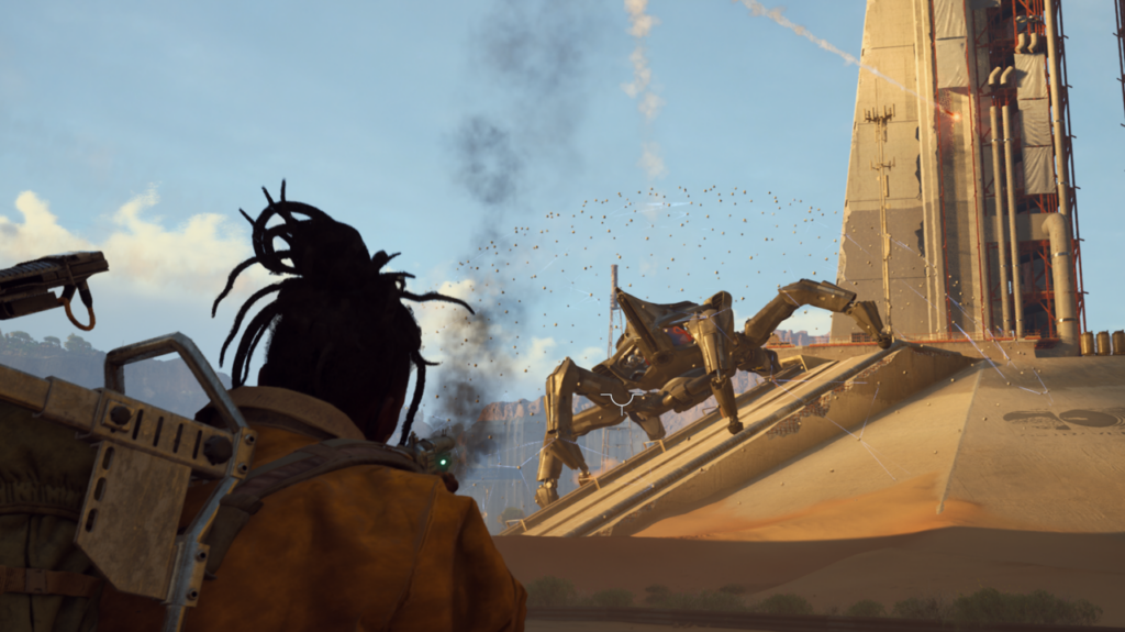A Raider looking up at a massive four-legged Matriarch machine climbing a desert structure in Arc Raiders.