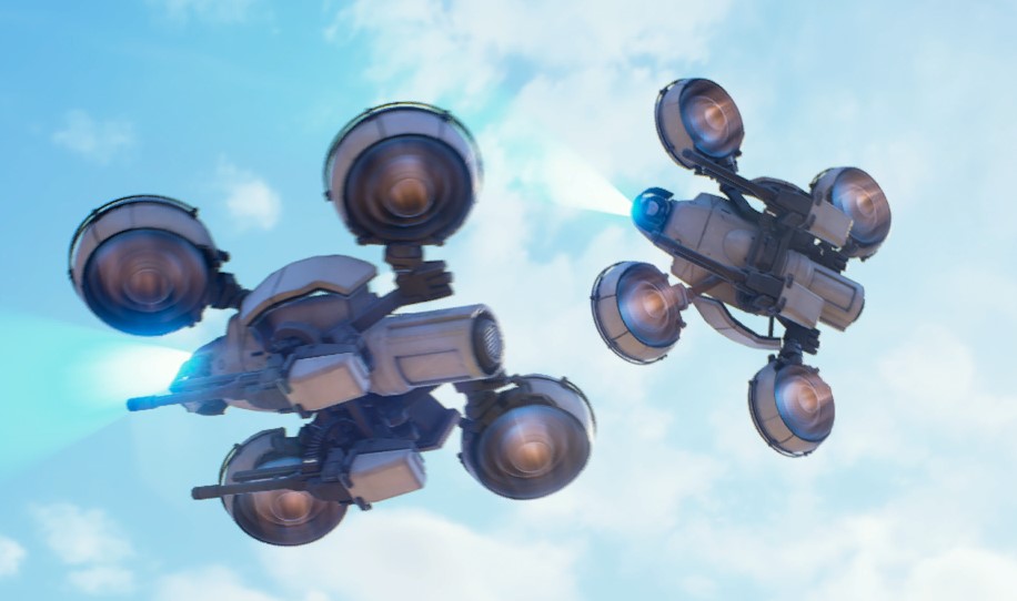 Two light Wasp drones with blue glowing sensors and four rotors flying in formation.