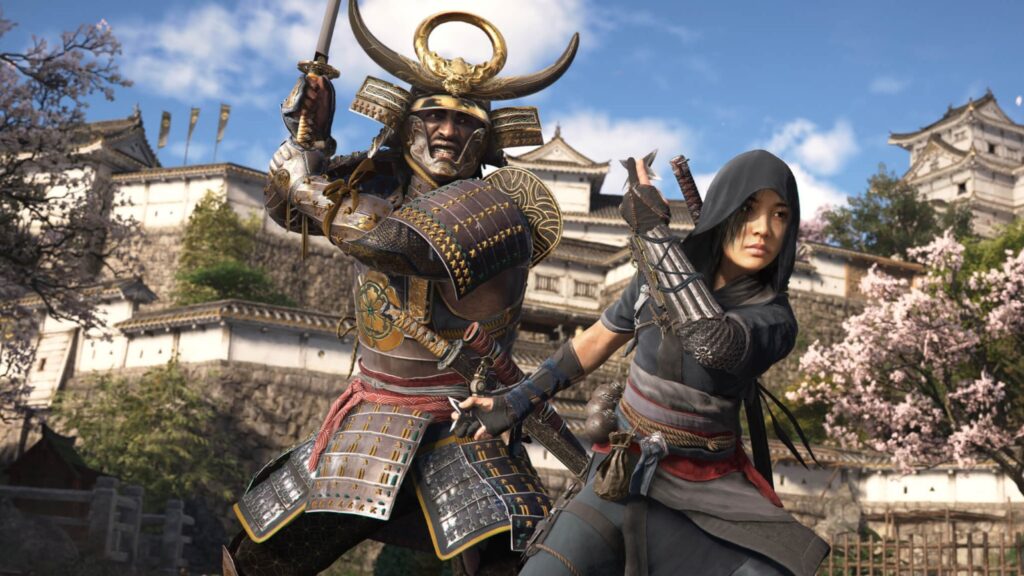 Co-protagonists Yasuke and Naoe stand poised for combat against the backdrop of a sprawling, historic Japanese fortress surrounded by cherry blossoms.